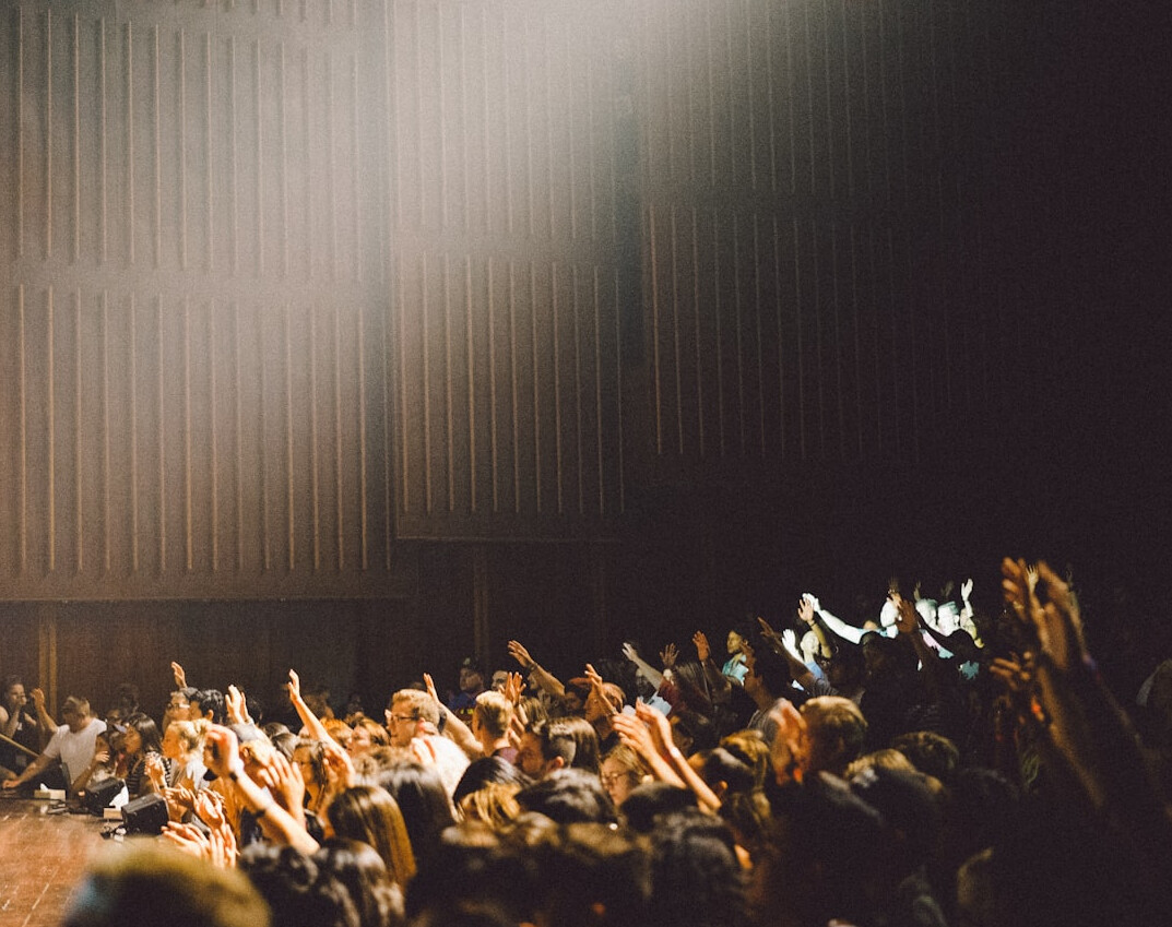 confident speaker inspiring crowd